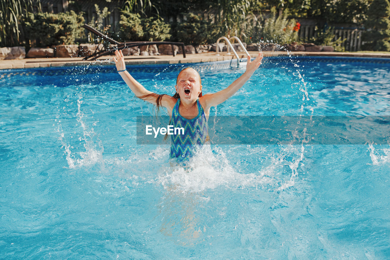 Girl swimming in pool