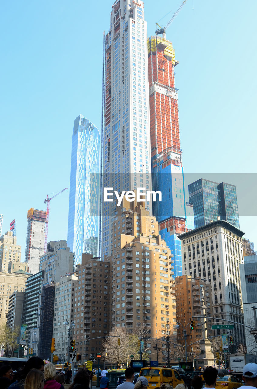 LOW ANGLE VIEW OF BUILDINGS AGAINST SKY IN CITY