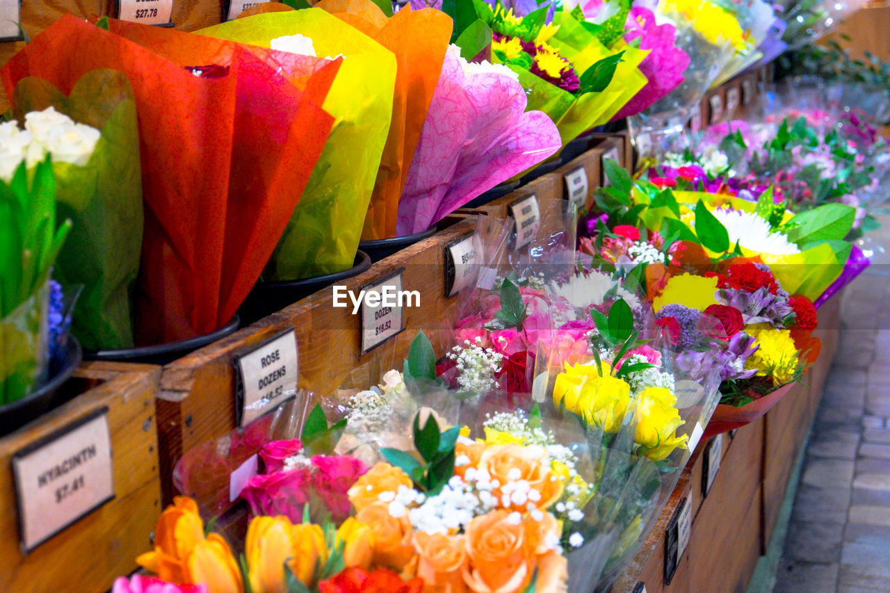 CLOSE-UP OF MULTI COLORED FLOWERS AT MARKET STALL