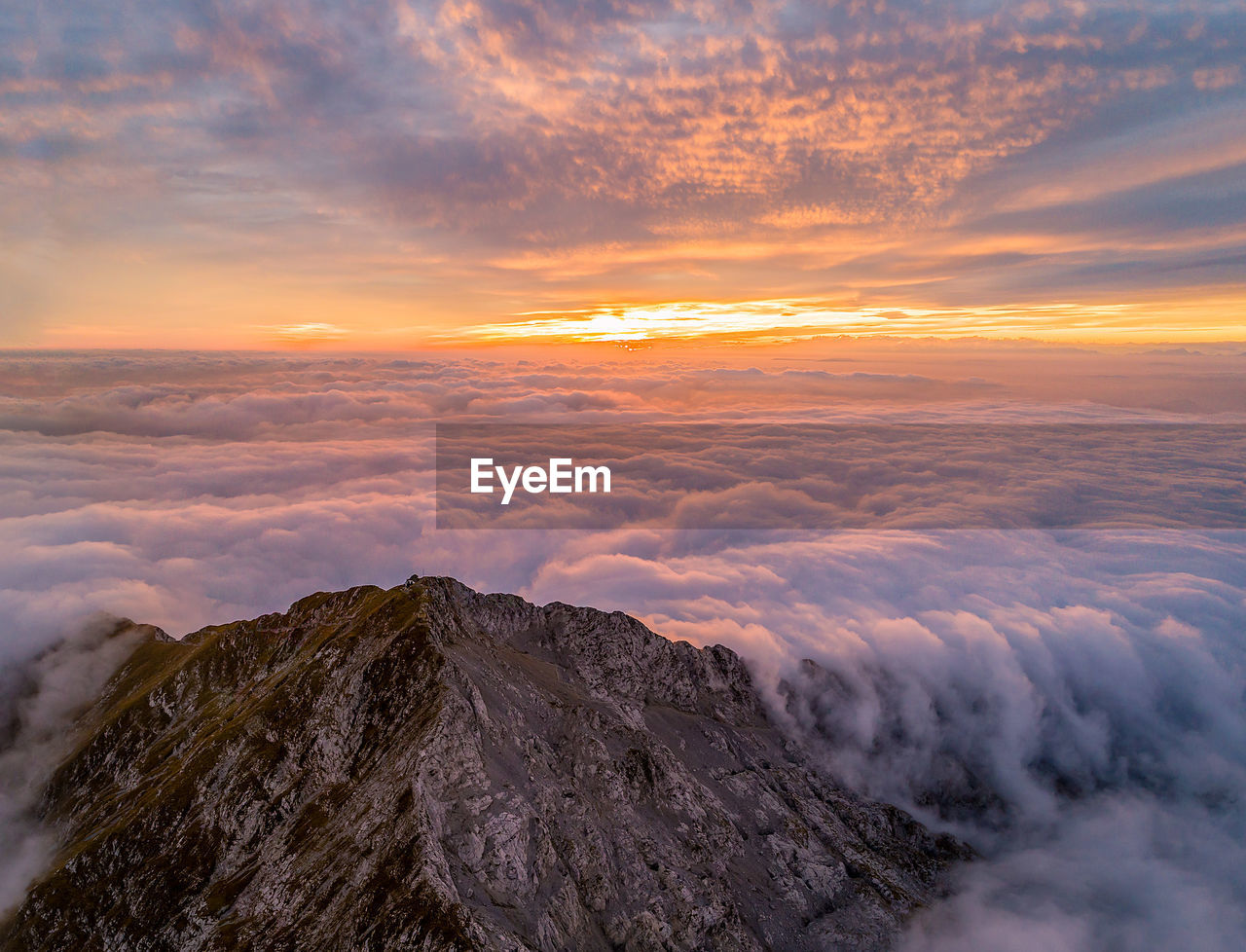 Scenic view of mountains against sky during sunset