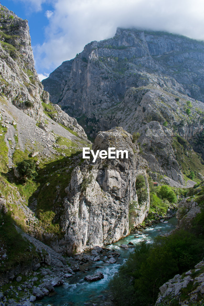 Scenic view of rocky mountains against sky, picos de europa