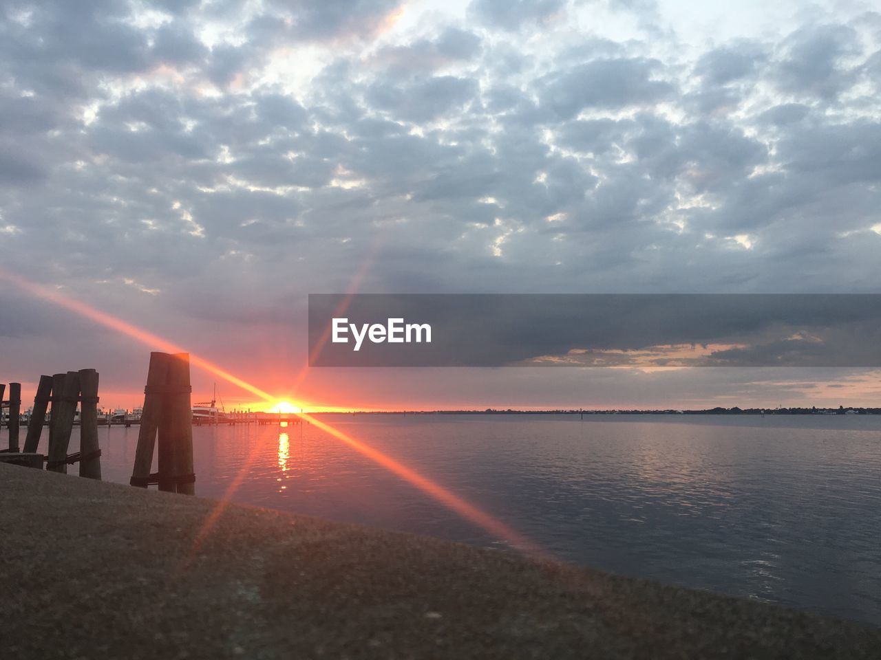 SCENIC VIEW OF SUNSET OVER SEA