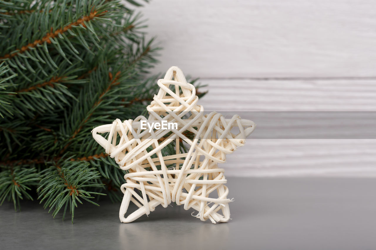 Christmas star on white wood background