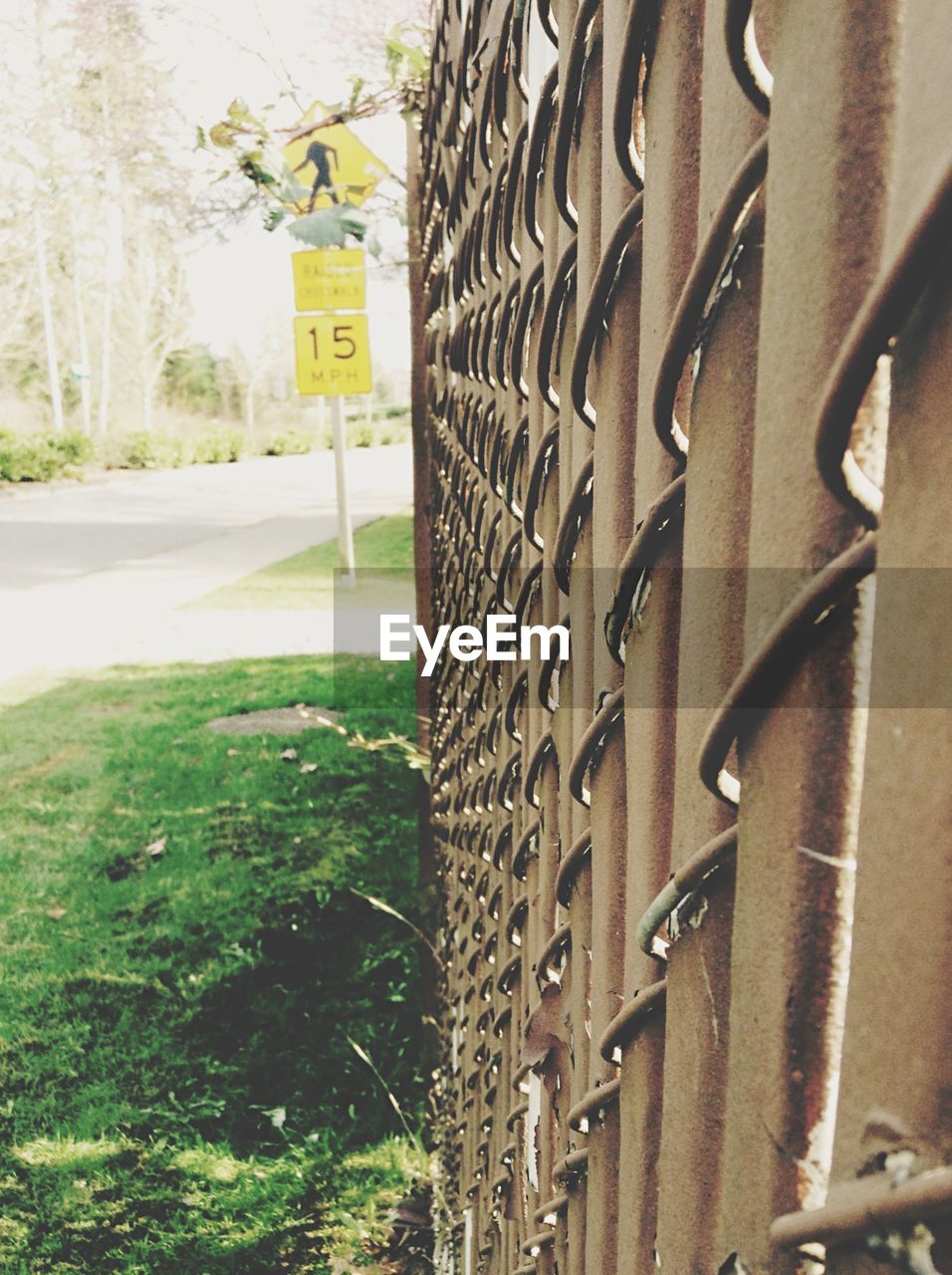 Metallic fence with road signboard