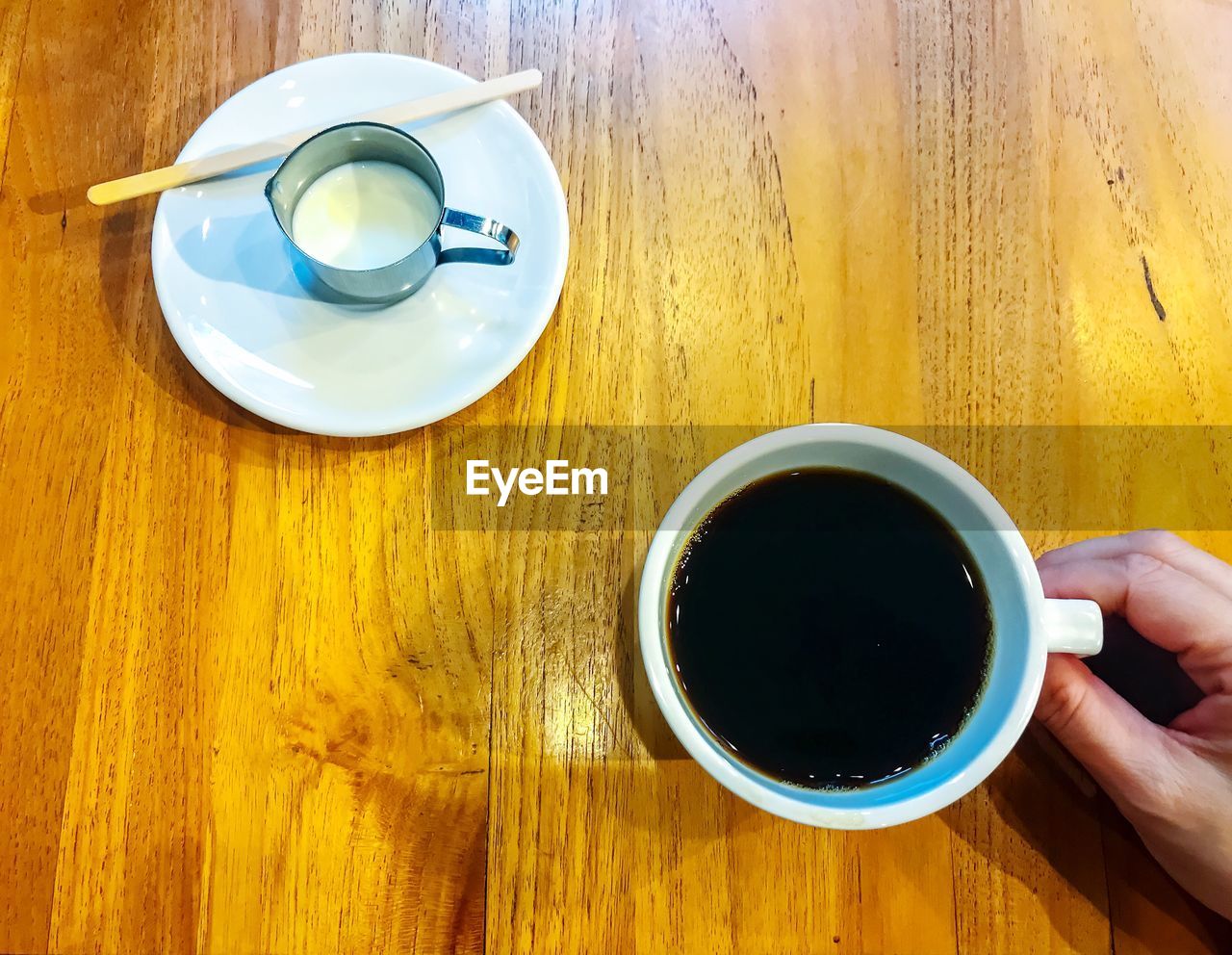 DIRECTLY ABOVE SHOT OF COFFEE CUP AND BLACK TEA