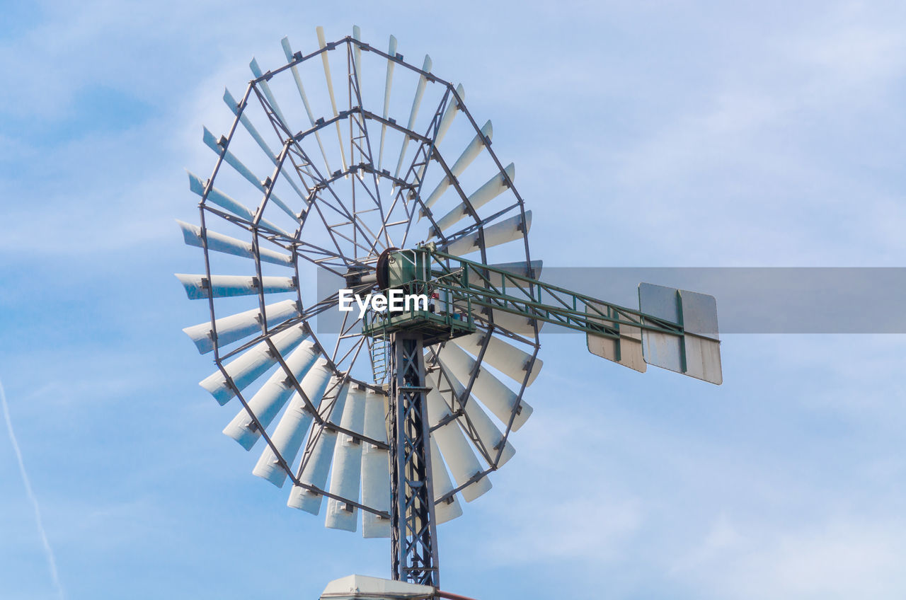 Low angle view of windmill