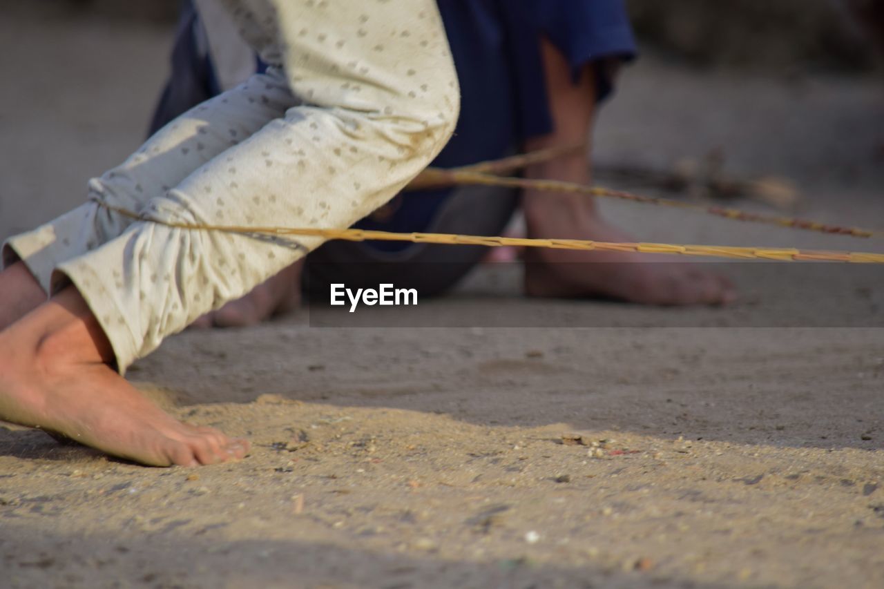 sand, adult, low section, human leg, one person, men, land, selective focus, human limb, limb, barefoot, clothing, person, day, occupation, nature