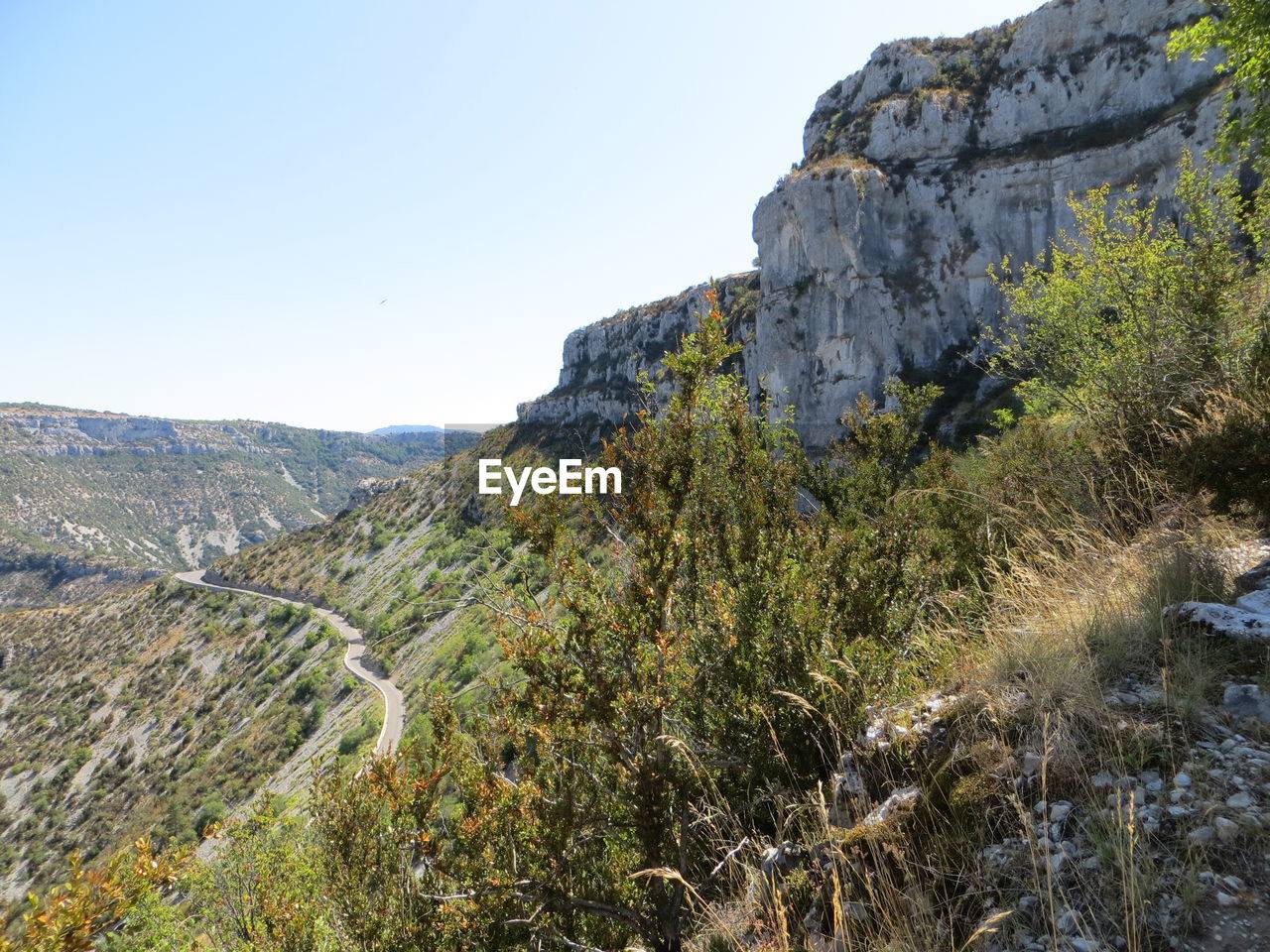 Scenic view of rocky mountains against clear sky