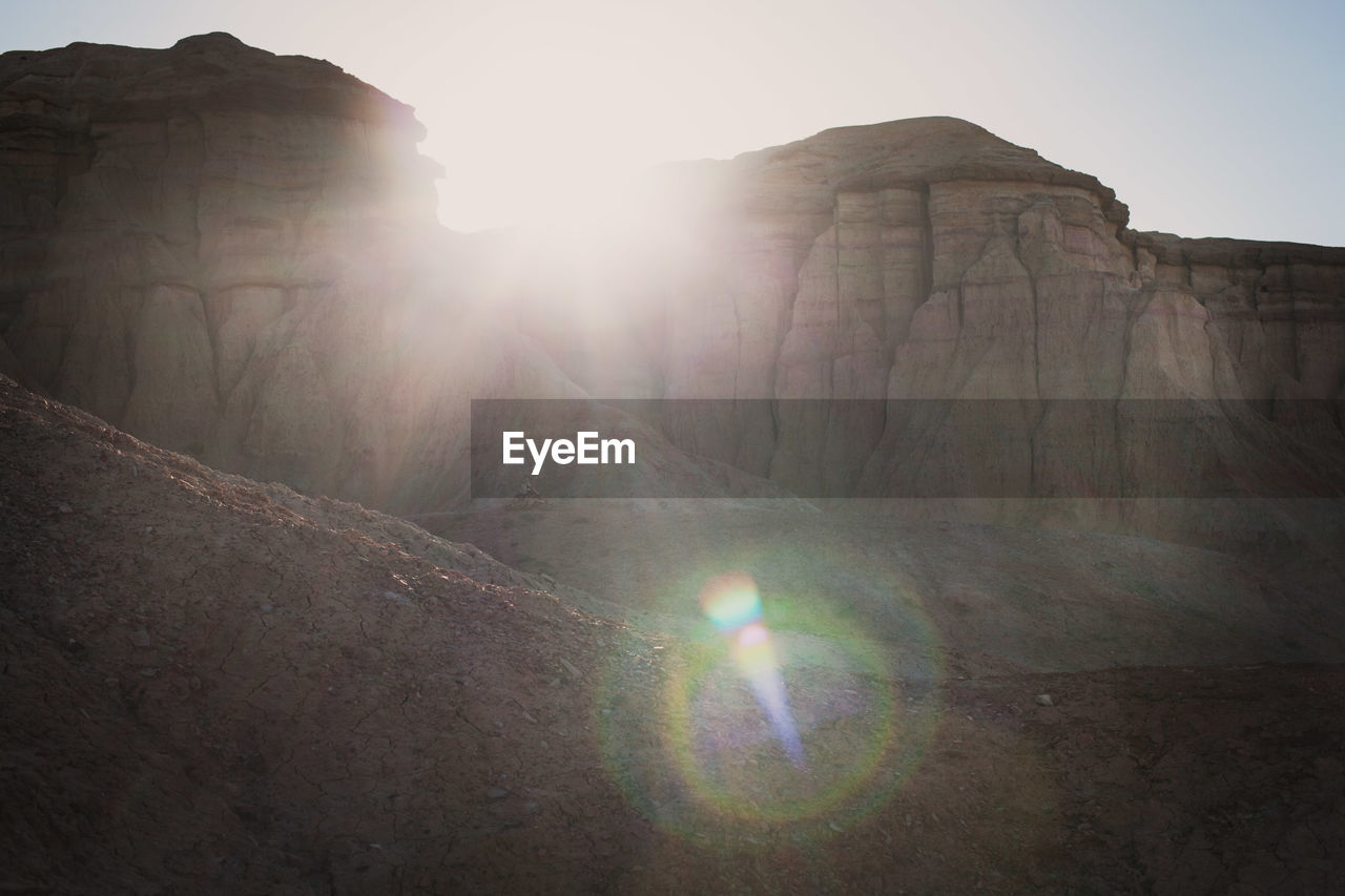 Sun shining through rock formations