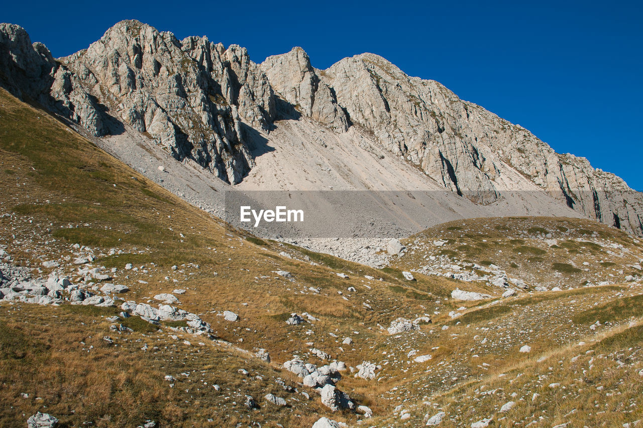 Scenic view of rock mountains against clear sky