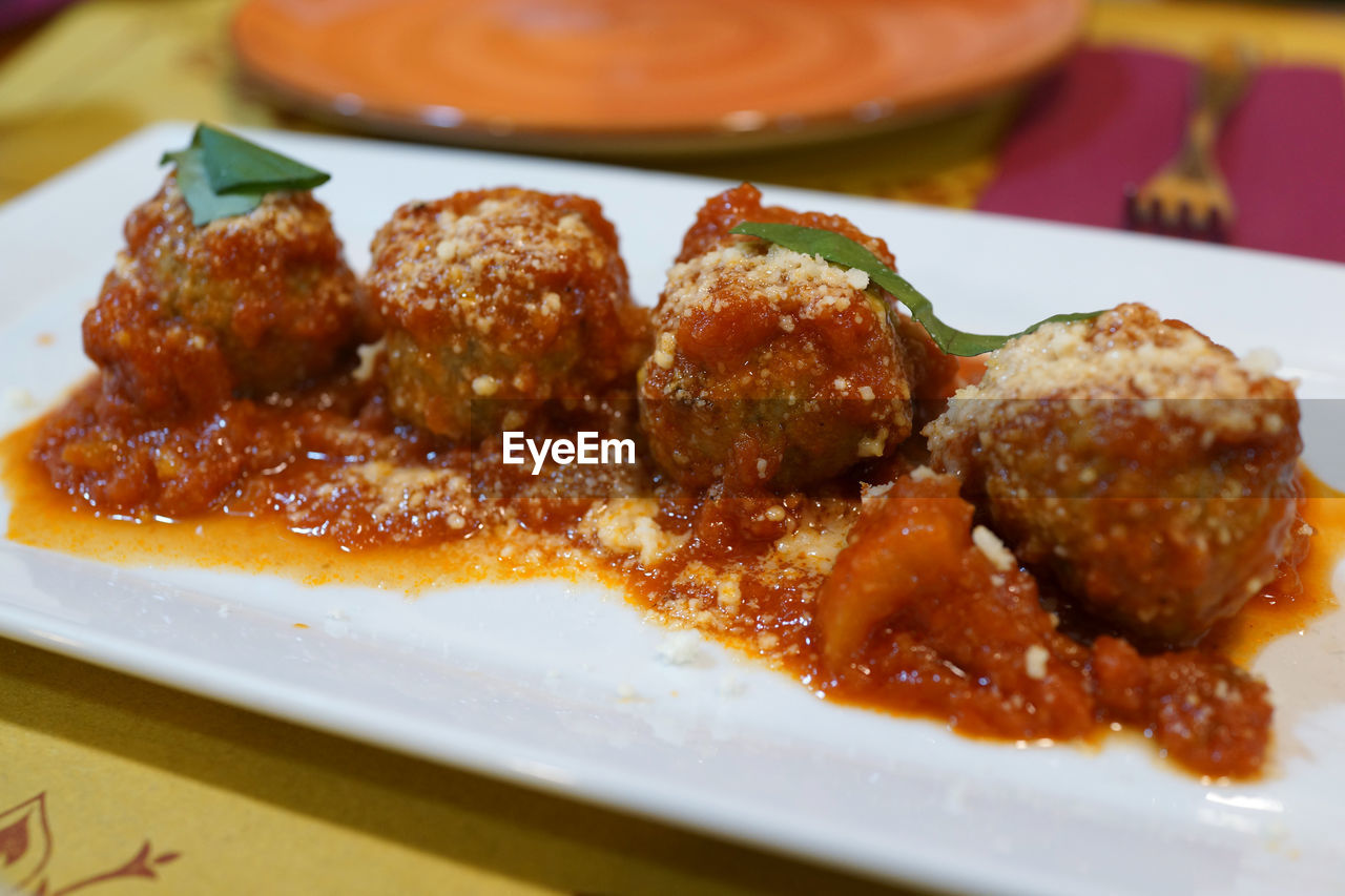 CLOSE-UP OF SERVED FOOD ON TABLE