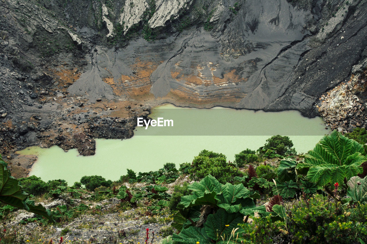 HIGH ANGLE VIEW OF LAKE AND ROCKS