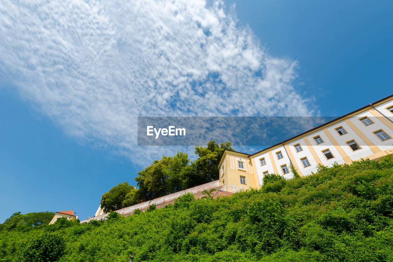 Low angle view of buildings against blue sky