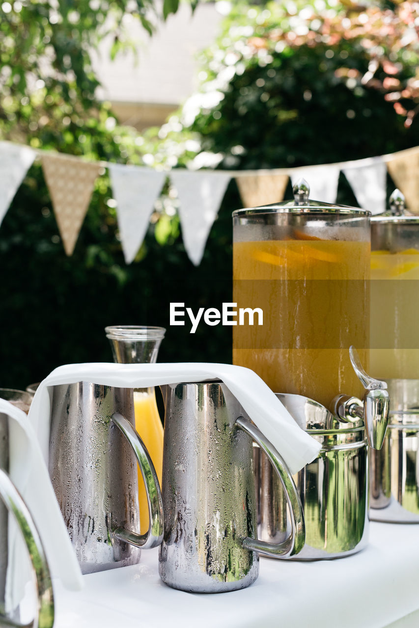 Drinks in containers on table during party