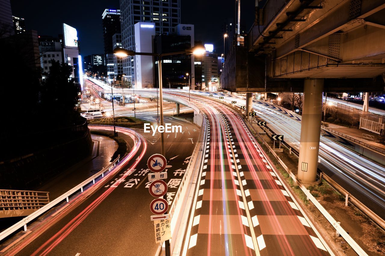 HIGH ANGLE VIEW OF LIGHT TRAILS ON BRIDGE