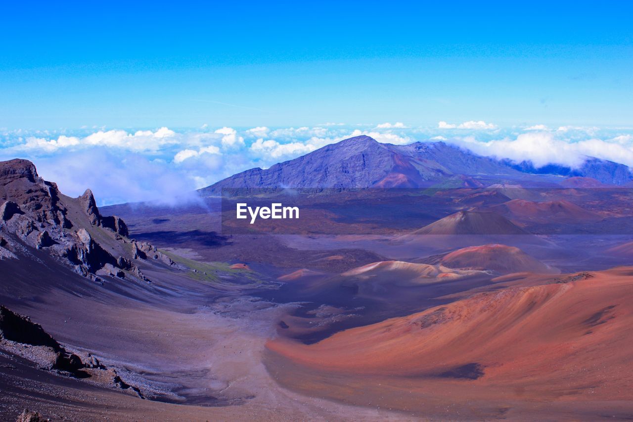 SCENIC VIEW OF LANDSCAPE AGAINST BLUE SKY