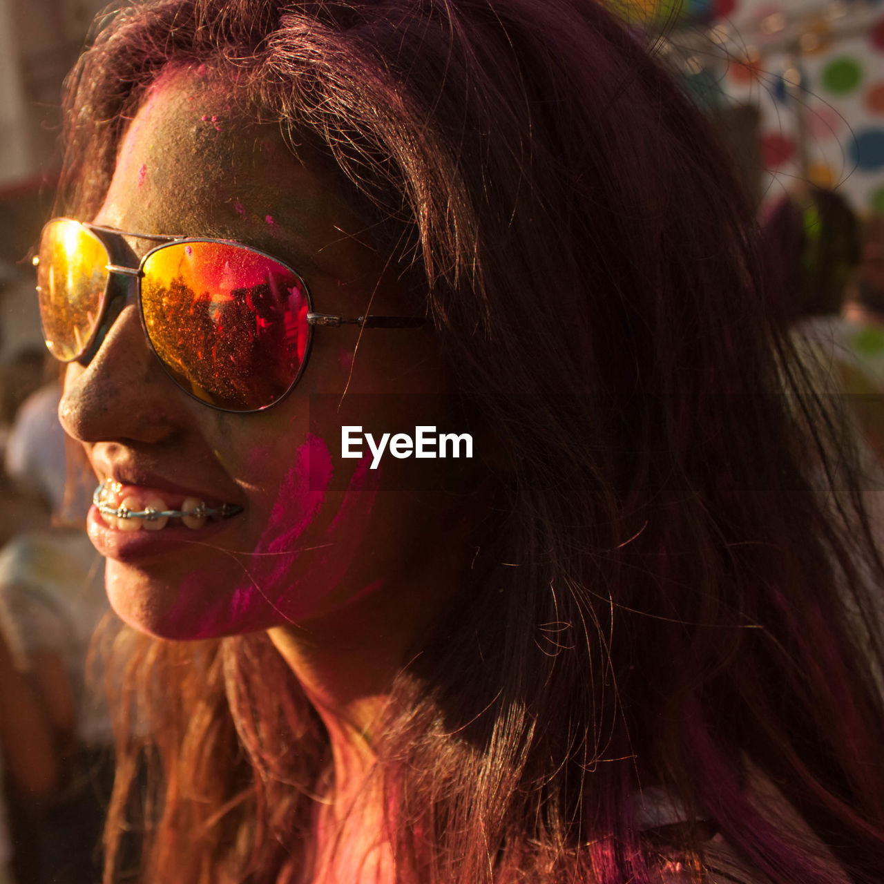 Close-up of messy woman with powder paint during holi