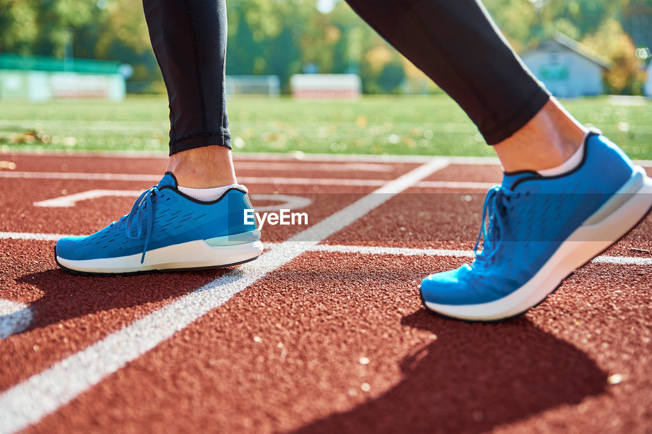 Running sneakers at stadium track