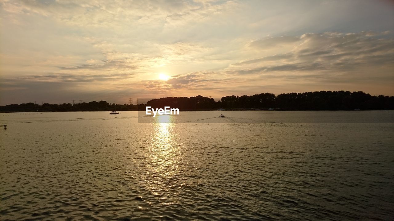 Scenic view of sea against sky at sunset