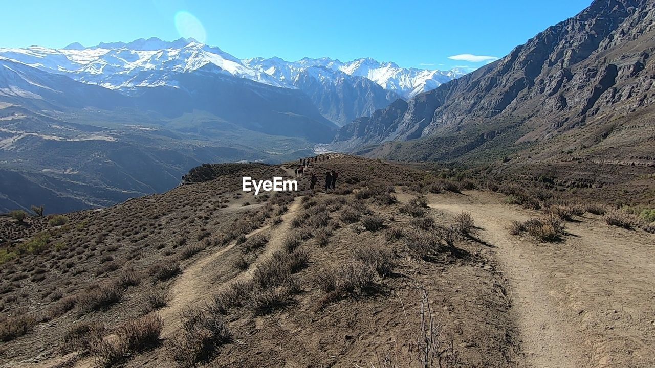 SCENIC VIEW OF SNOWCAPPED MOUNTAIN AGAINST SKY