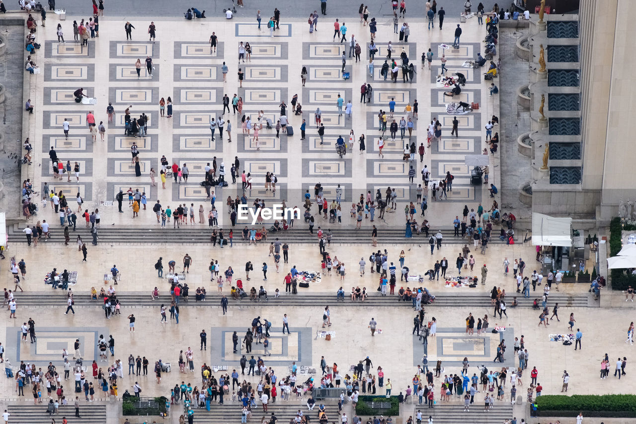 HIGH ANGLE VIEW OF PEOPLE IN A CITY