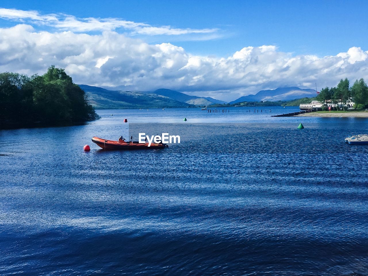 BOATS MOORED IN SEA