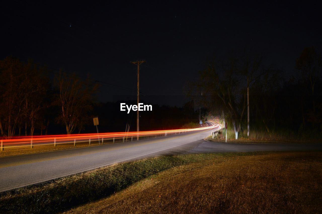 Light trails on road at night