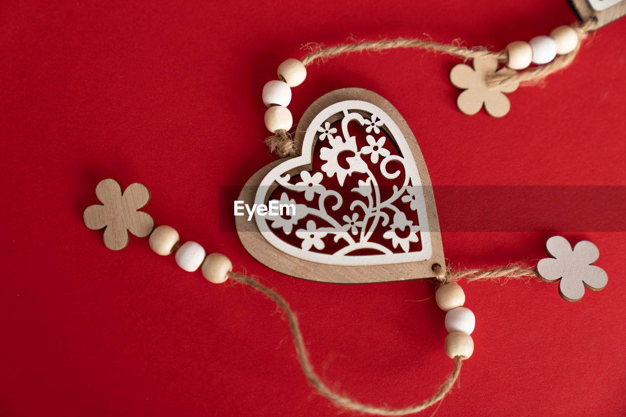 heart, red, jewellery, colored background, studio shot, red background, no people, indoors, heart shape, necklace, pink, fashion accessory, decoration, food and drink, high angle view, still life, pendant, shape, sweet food