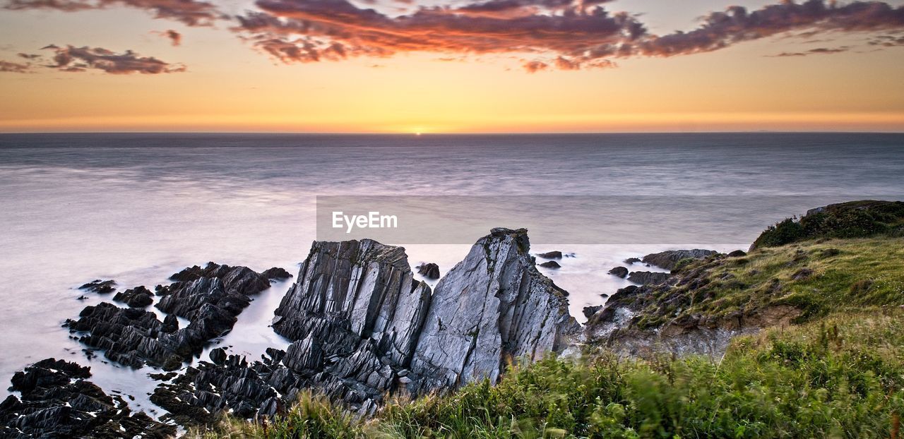 Scenic view of sea against sky during sunset