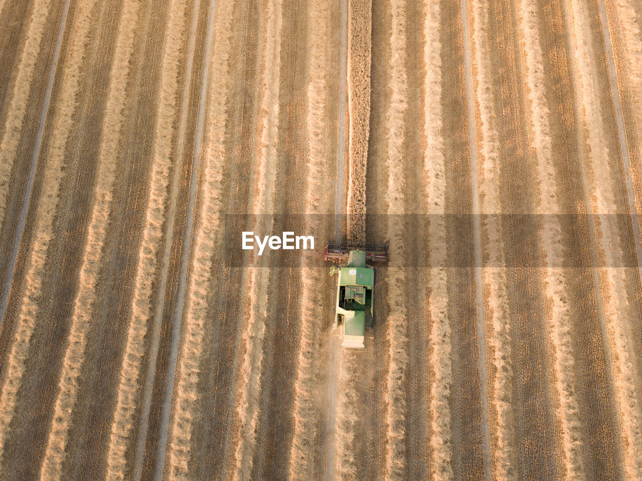 Aerial view of combine harvester on agriculture landscape