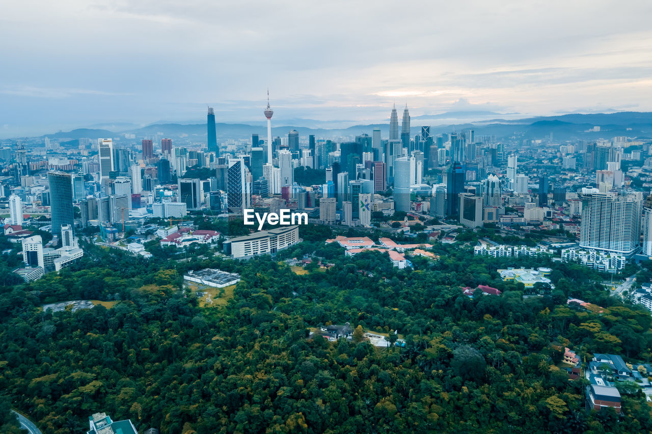 HIGH ANGLE VIEW OF BUILDINGS AGAINST SKY