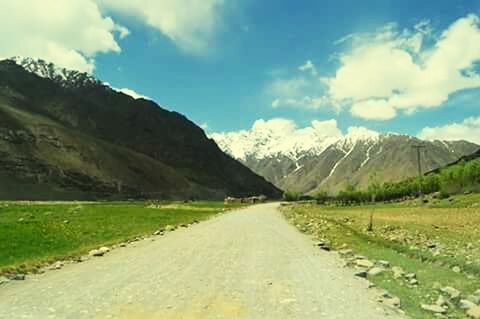 ROAD PASSING THROUGH MOUNTAINS