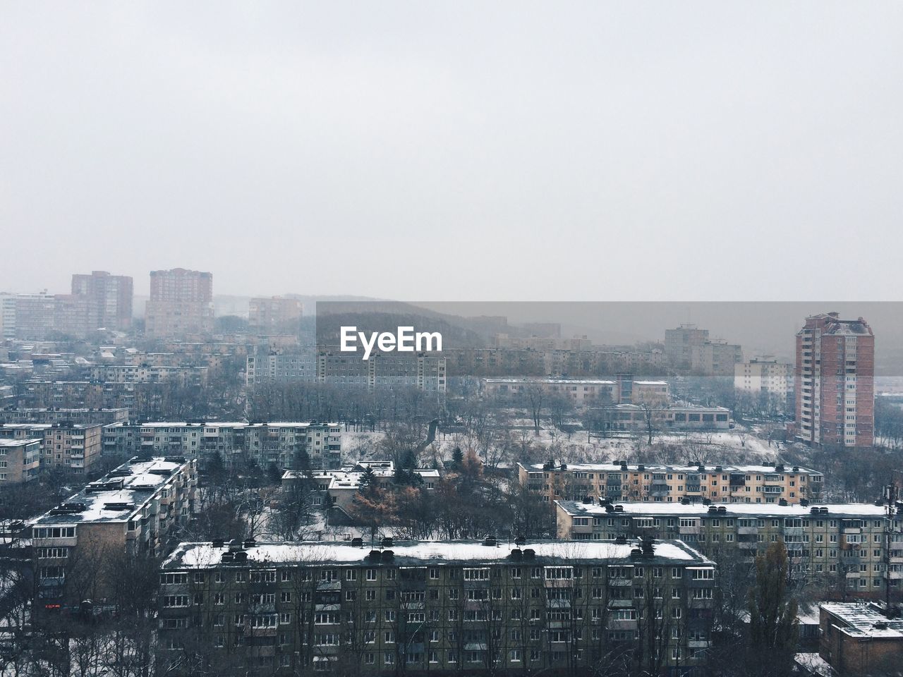 High angle view of buildings in city against sky