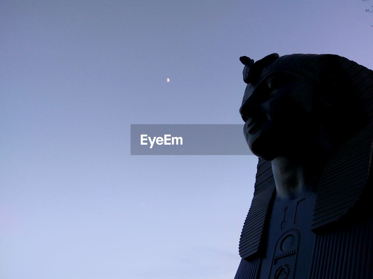 LOW ANGLE VIEW OF STATUES AGAINST CLEAR SKY