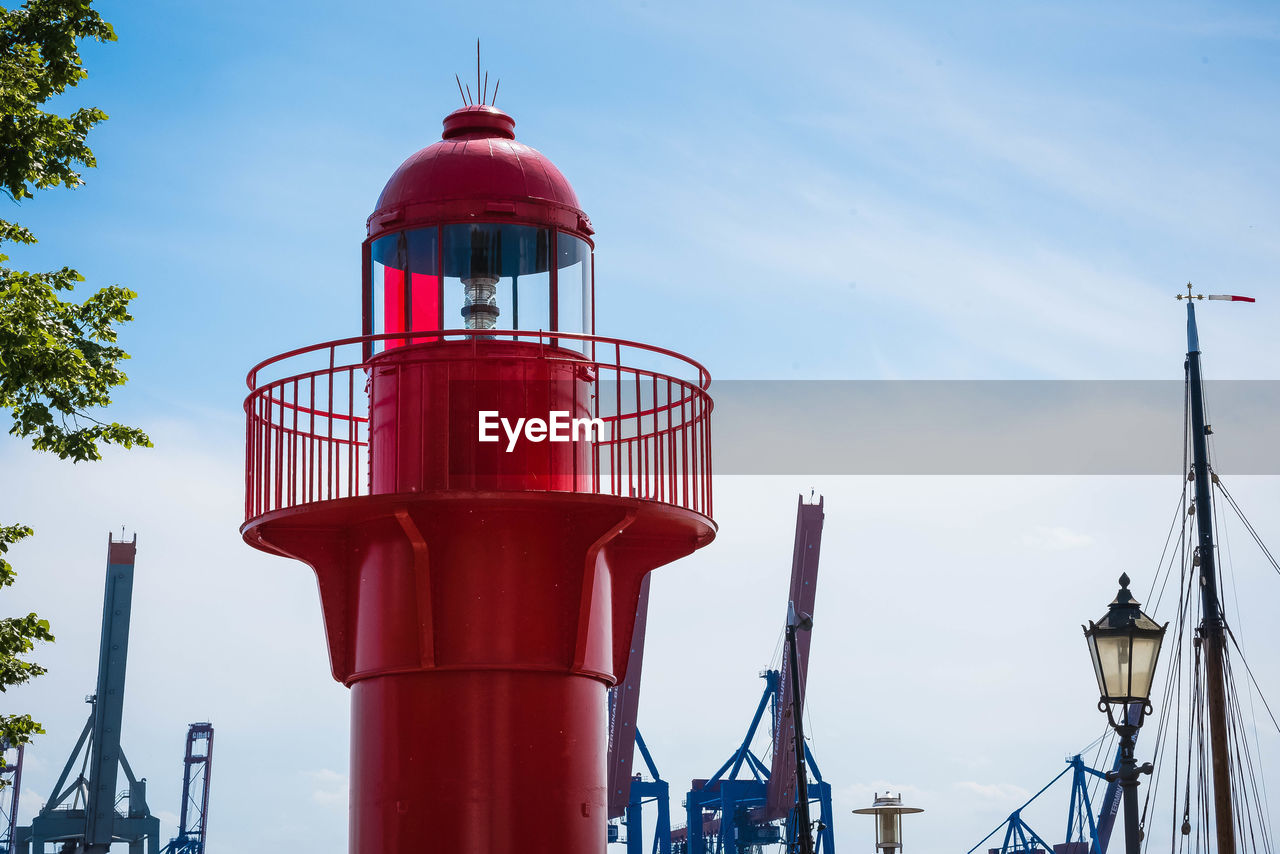 LOW ANGLE VIEW OF RED TOWER AGAINST SKY