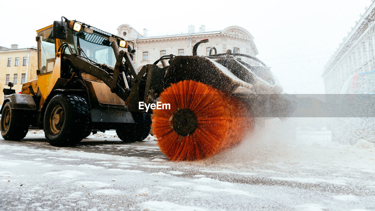 VIEW OF SNOW COVERED CAR ON FIELD