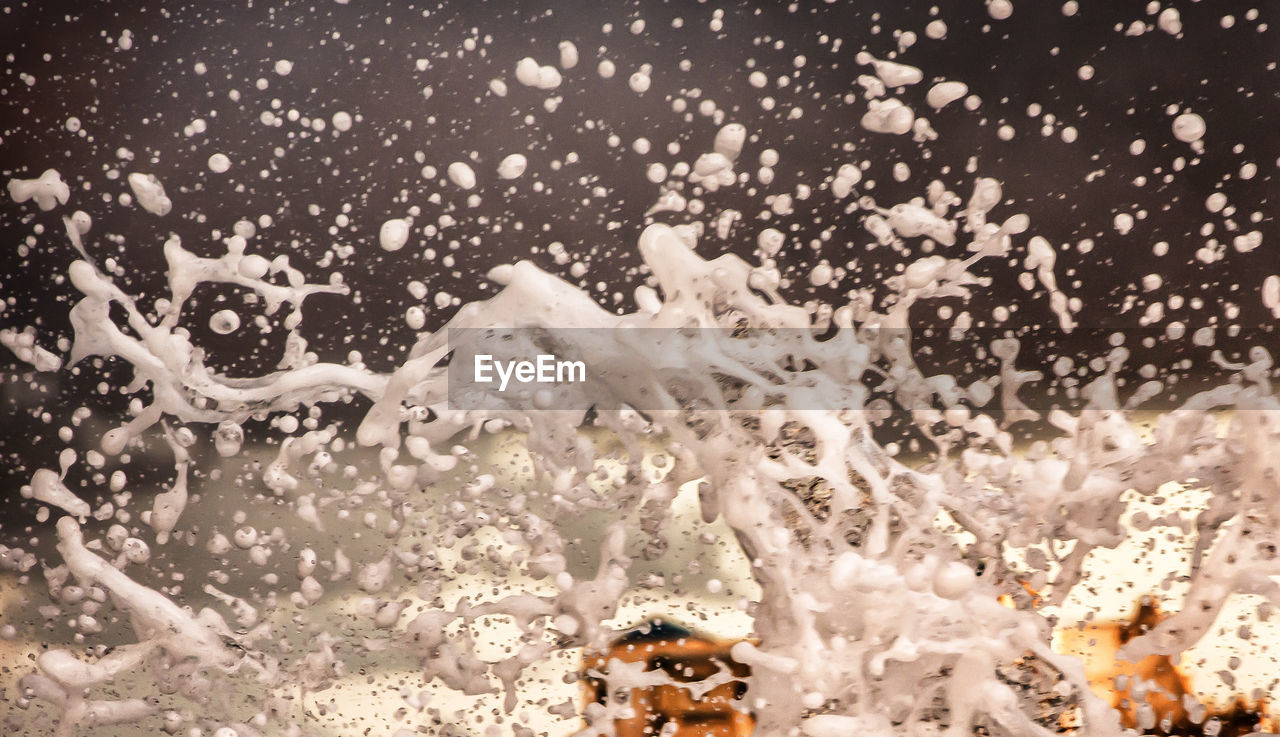 CLOSE-UP OF SNOWFLAKES ON GROUND