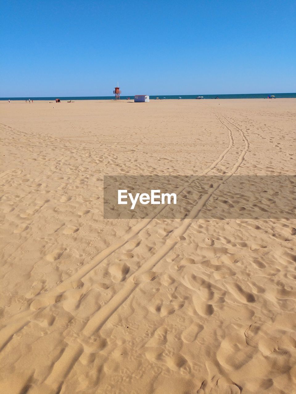 Scenic view of beach against clear sky