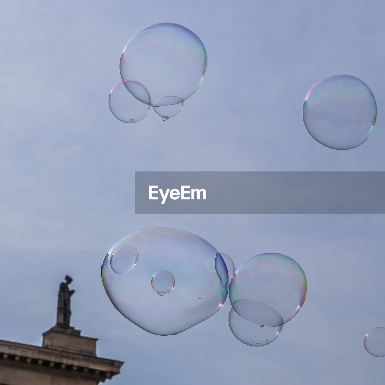 Low angle view of bubbles against sky