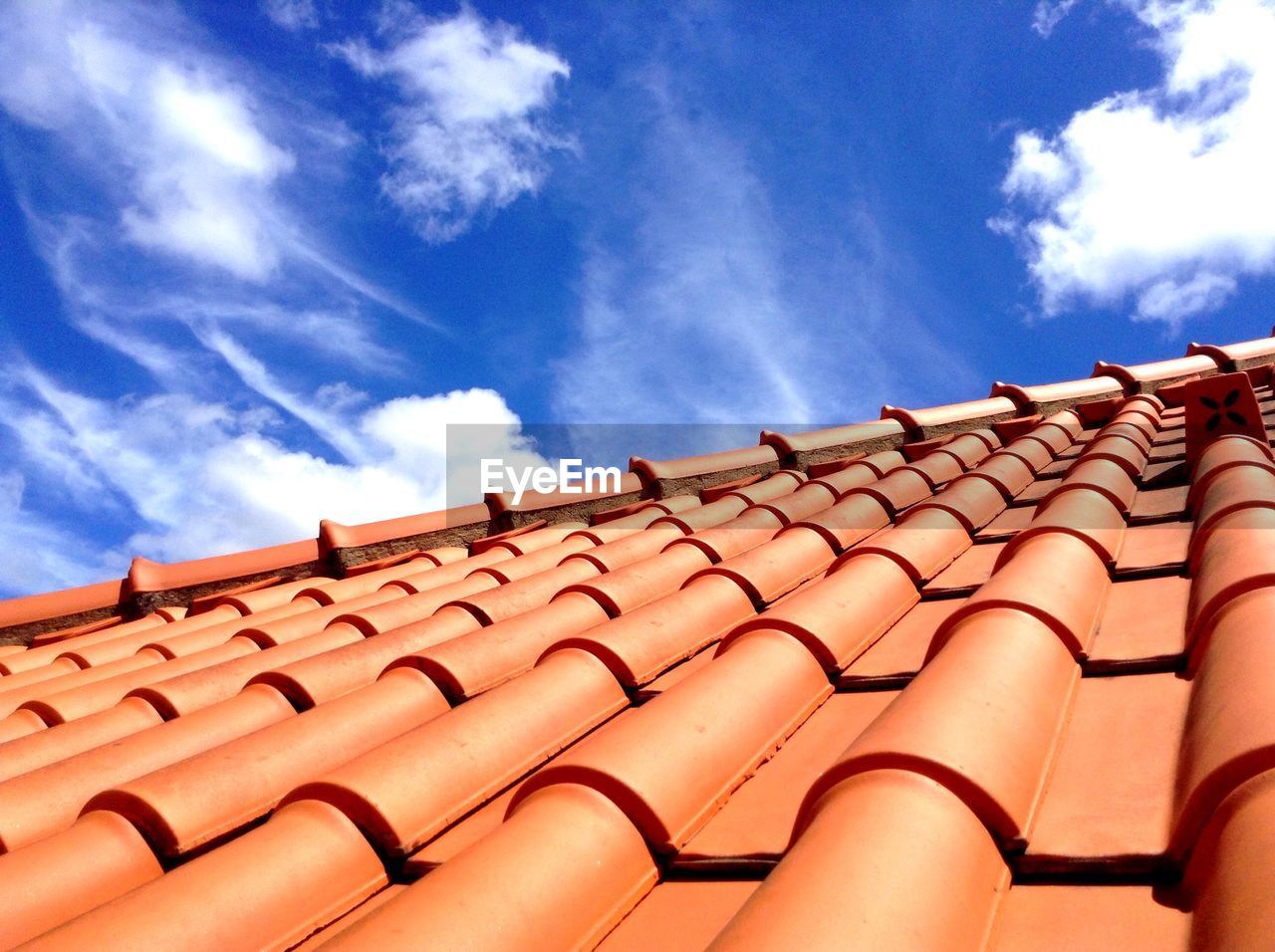 High angle view of roof tiles against sky