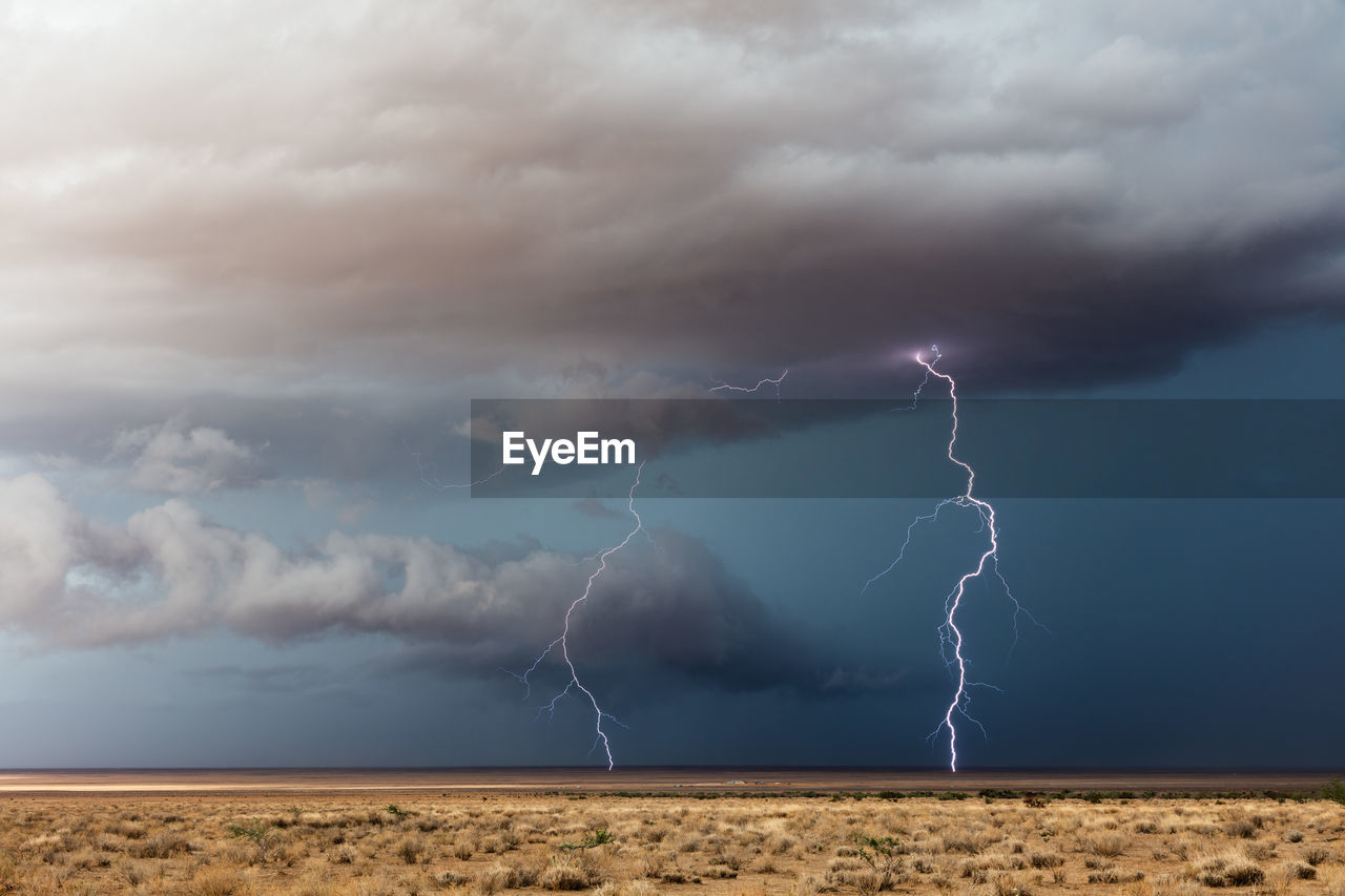 A thunderstorm with vivid lightning strikes  drifts across the desert near dolan springs, arizona.