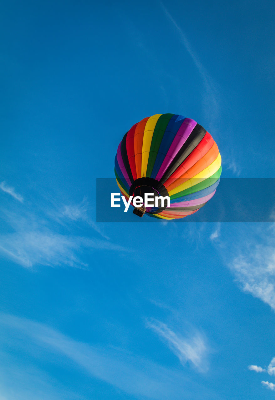 LOW ANGLE VIEW OF HOT AIR BALLOON IN SKY