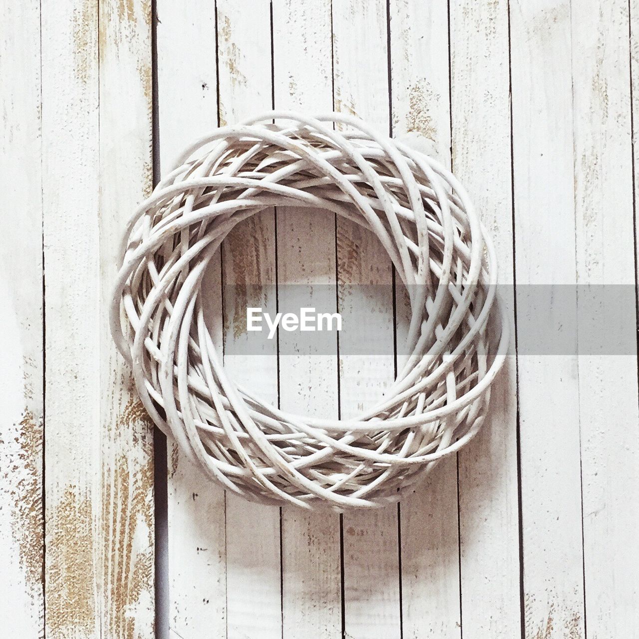 Directly above shot of wicker wreath on wooden table