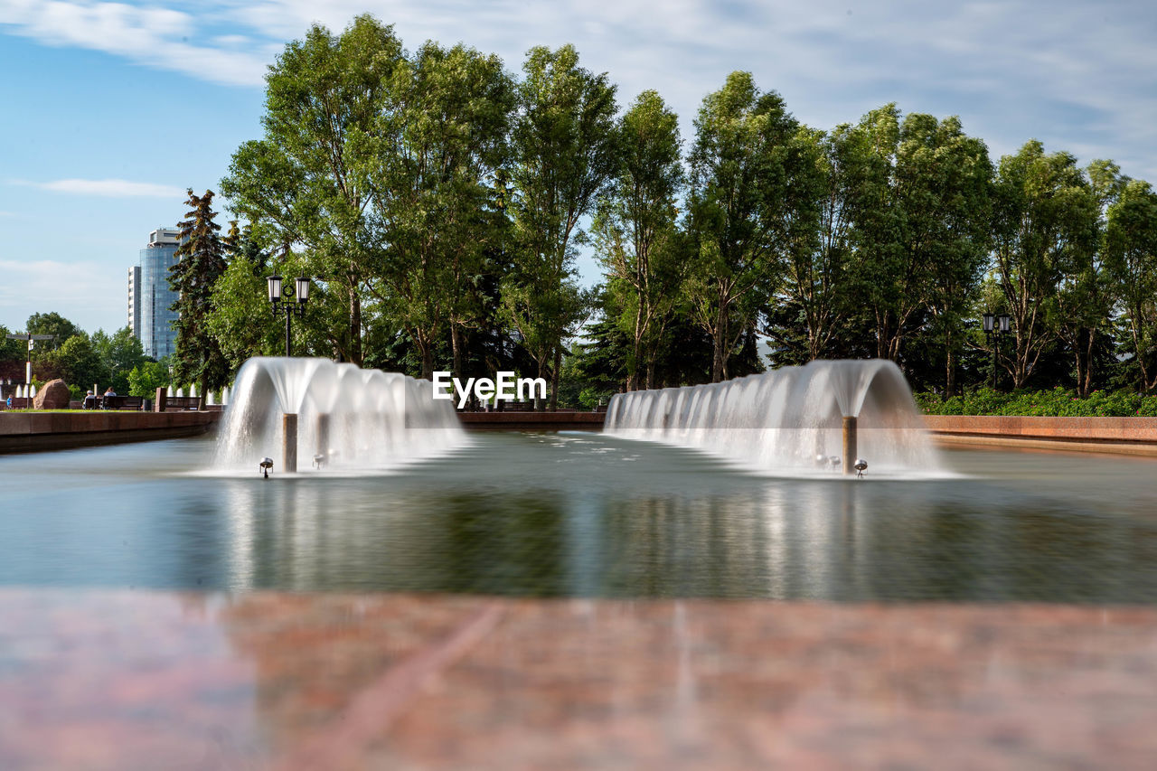 SCENIC VIEW OF WATERFALL IN SWIMMING POOL