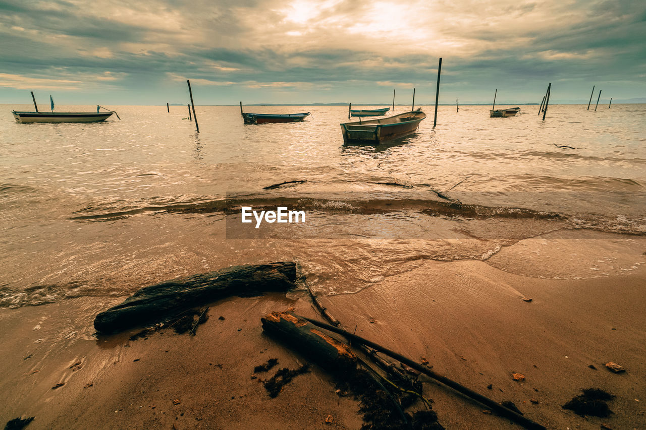 scenic view of beach during sunset