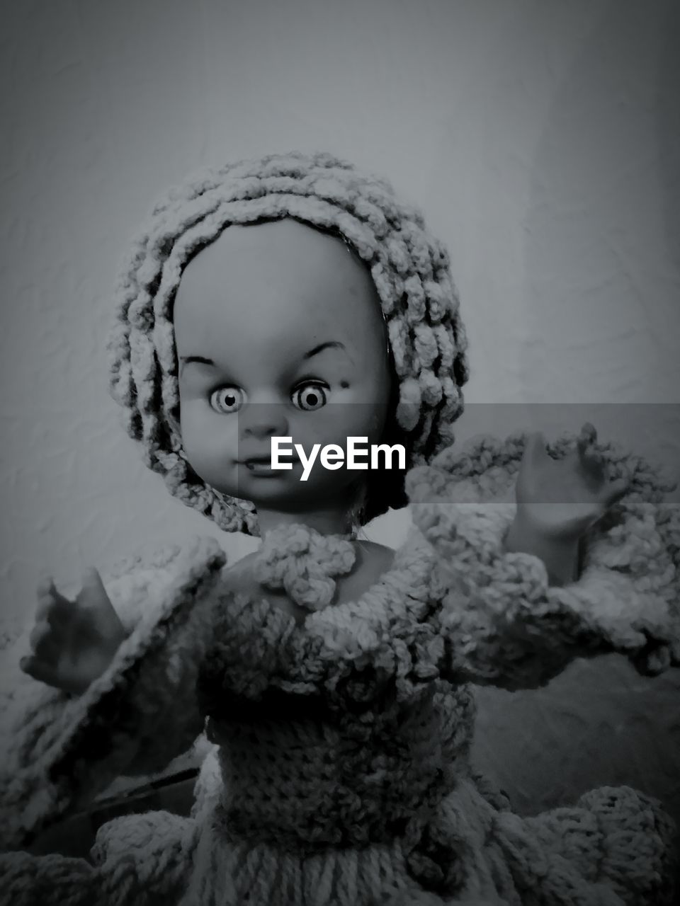 Close-up of doll against wall