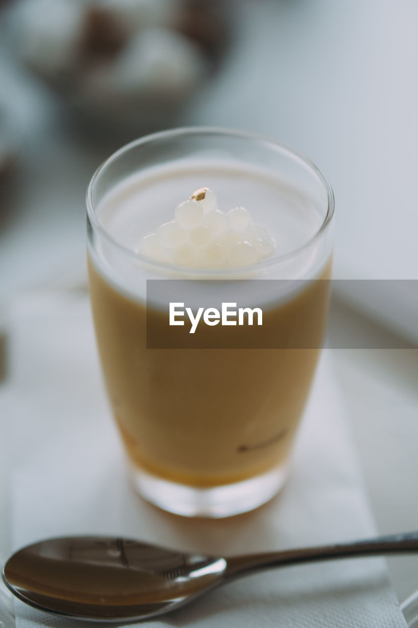 food and drink, drink, food, refreshment, household equipment, glass, drinking glass, spoon, eating utensil, kitchen utensil, dessert, indoors, close-up, breakfast, no people, focus on foreground, produce, coffee, meal, freshness, dairy, healthy eating, latte