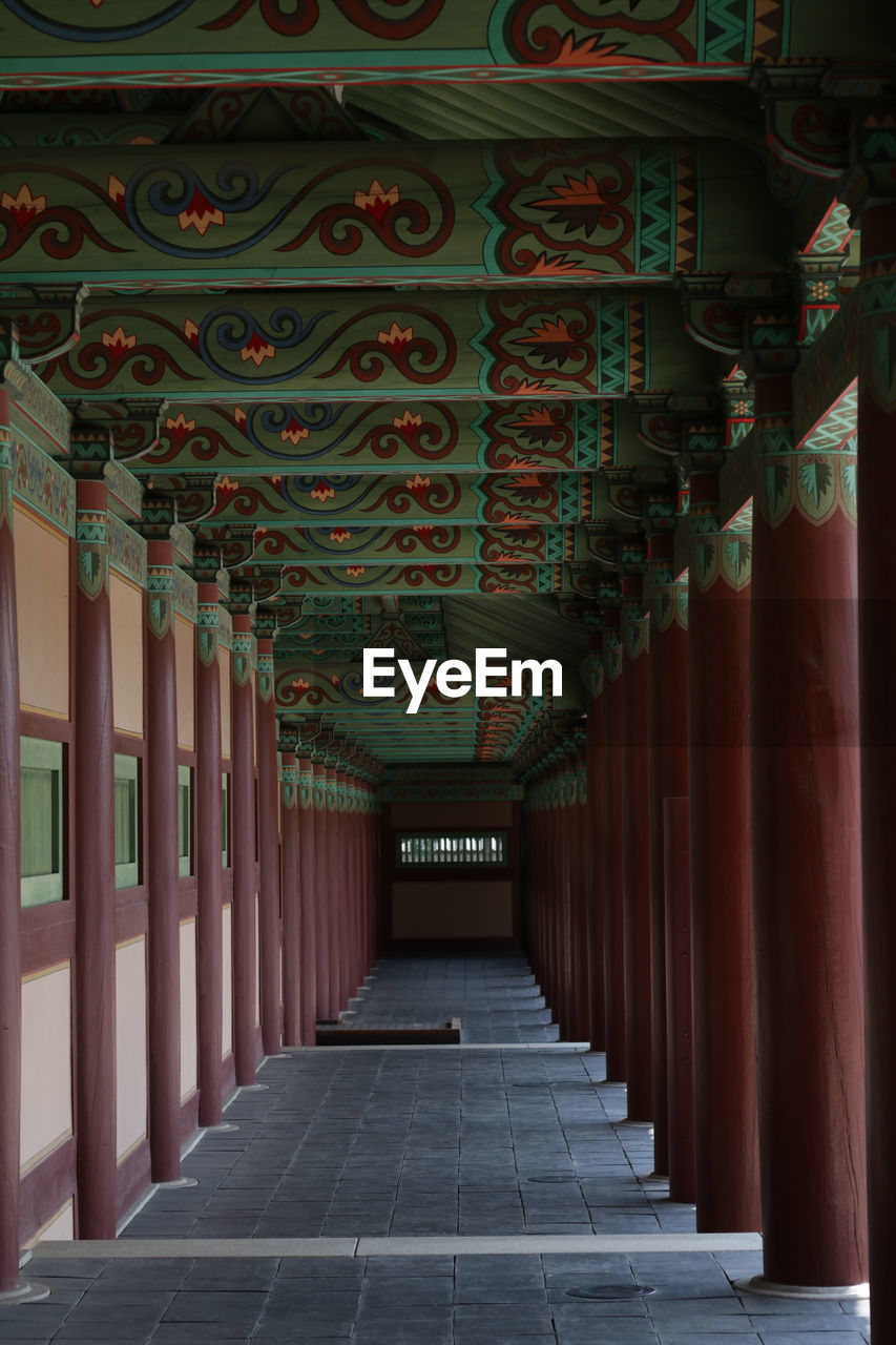 EMPTY CORRIDOR OF BUILDING WITH TEMPLE