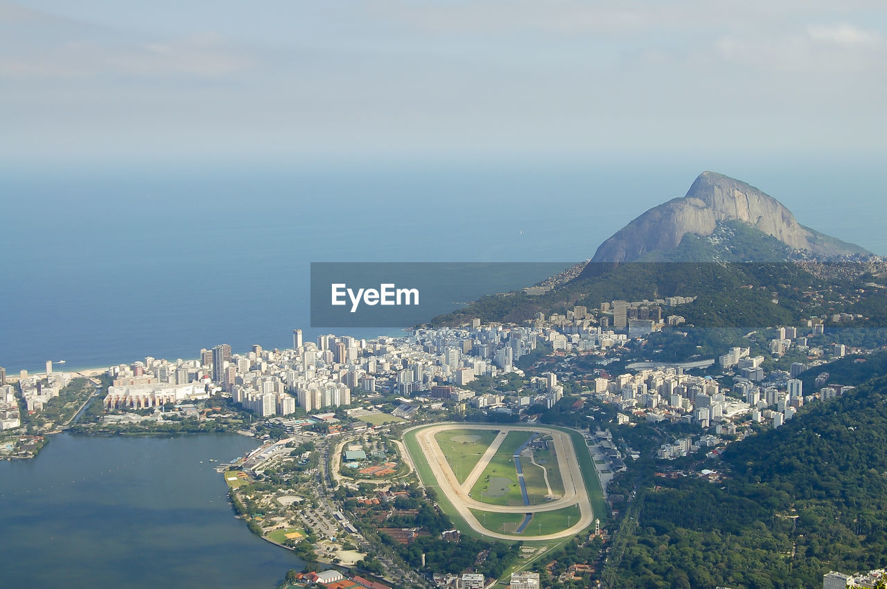 High angle view of city by sea