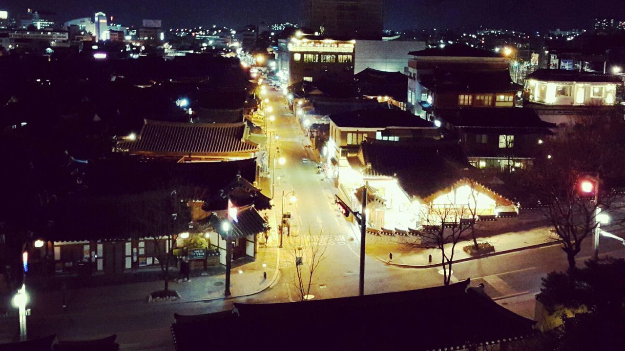 VIEW OF ILLUMINATED BUILDINGS AT NIGHT